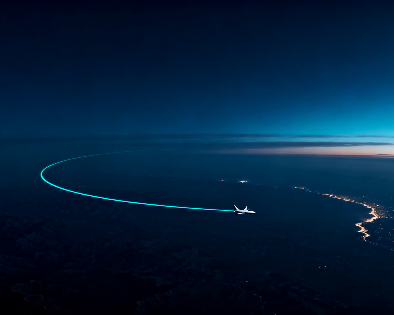 A business jet at night, its flight path drawn as a single line of light